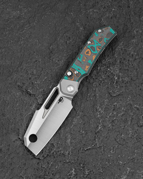 BESTECH NYRRDREKI BT2607C Titanium with Shipwreck Camo Carbon Inlays Handle: 3.08" M390 Blade, Thumb Hole, Front Flipper with Button Bolster Lock, Hollow Grind